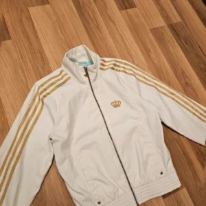 Adidas Kurtka wiatrówka Windbreaker biała złota
